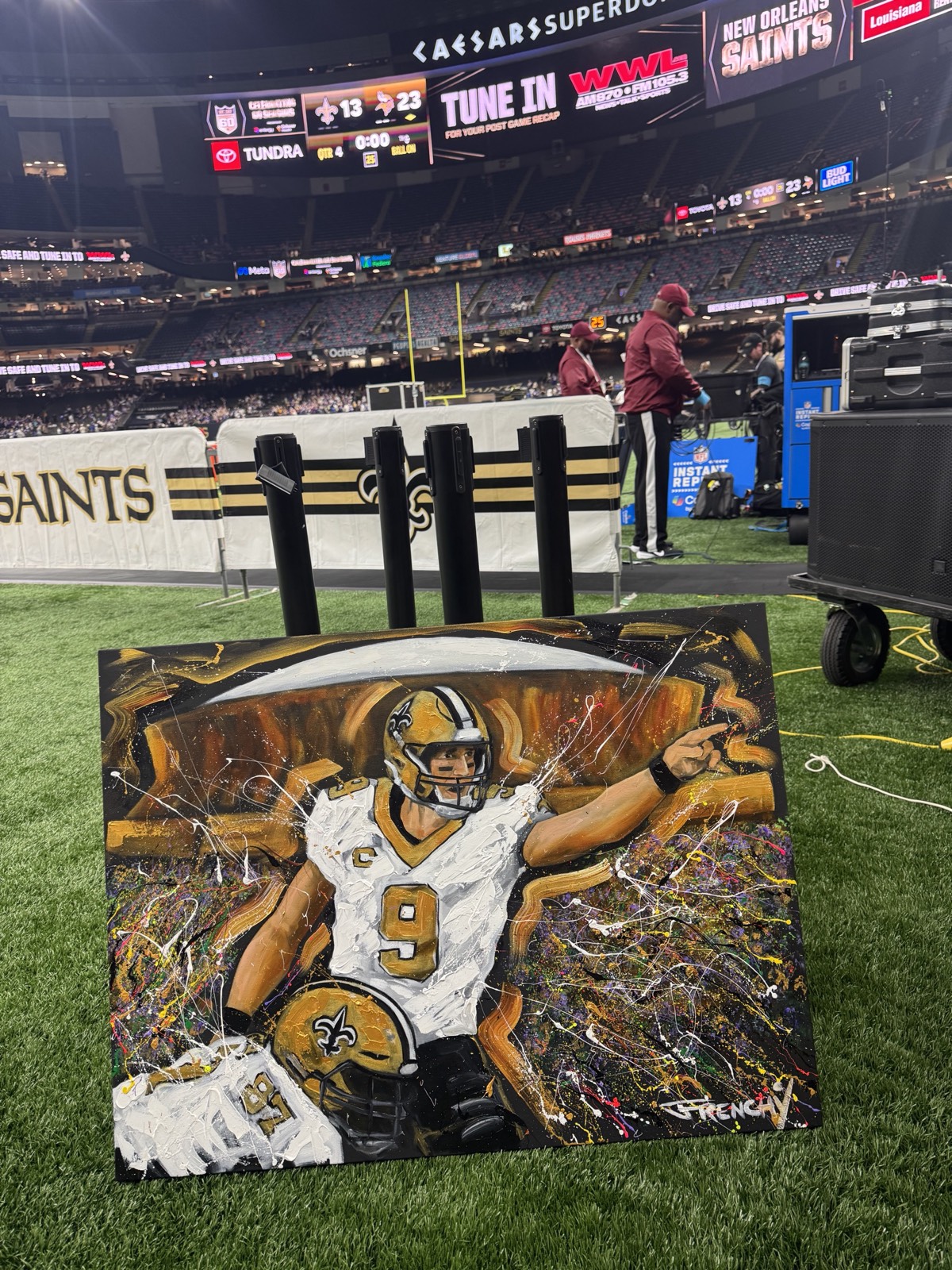 Frenchy's Drew Brees painting on the Saints sideline in the Superdome after the game