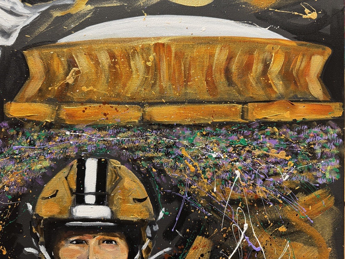 Detail of the Superdome and the crowd in purple, green and gold